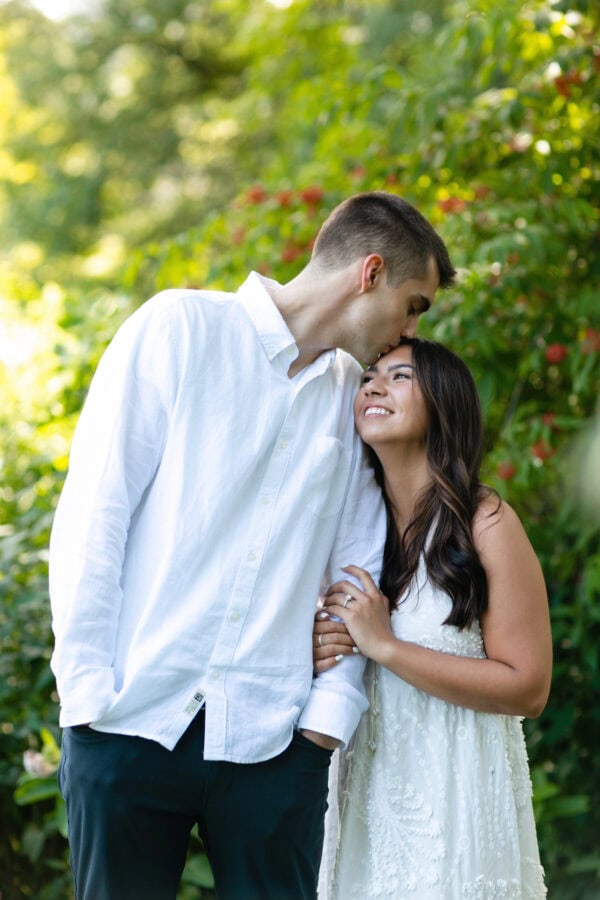 engaged couple poses for a photo at lincoln park zoo chicago