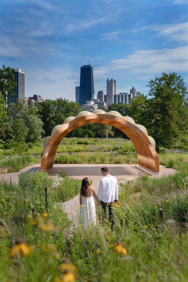 engaged couple poses for a photo at lincoln park zoo chicago