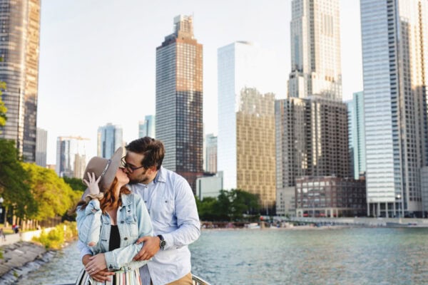 engaged couple poses for a photo at milton lee olive park chicago