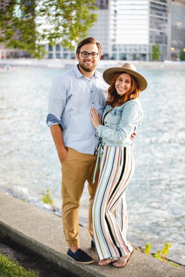 engaged couple poses for a photo at milton lee olive park chicago